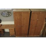 A pair of wardrobes and a contemporary pine dressing table.