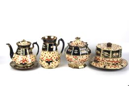 Five pieces of English pottery in the Imari style.