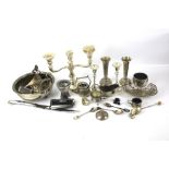 An assortment of silver plate. Including a candlestick, posy vases, a sauceboat, etc.