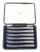 A set of six George V silver handled butter knives.