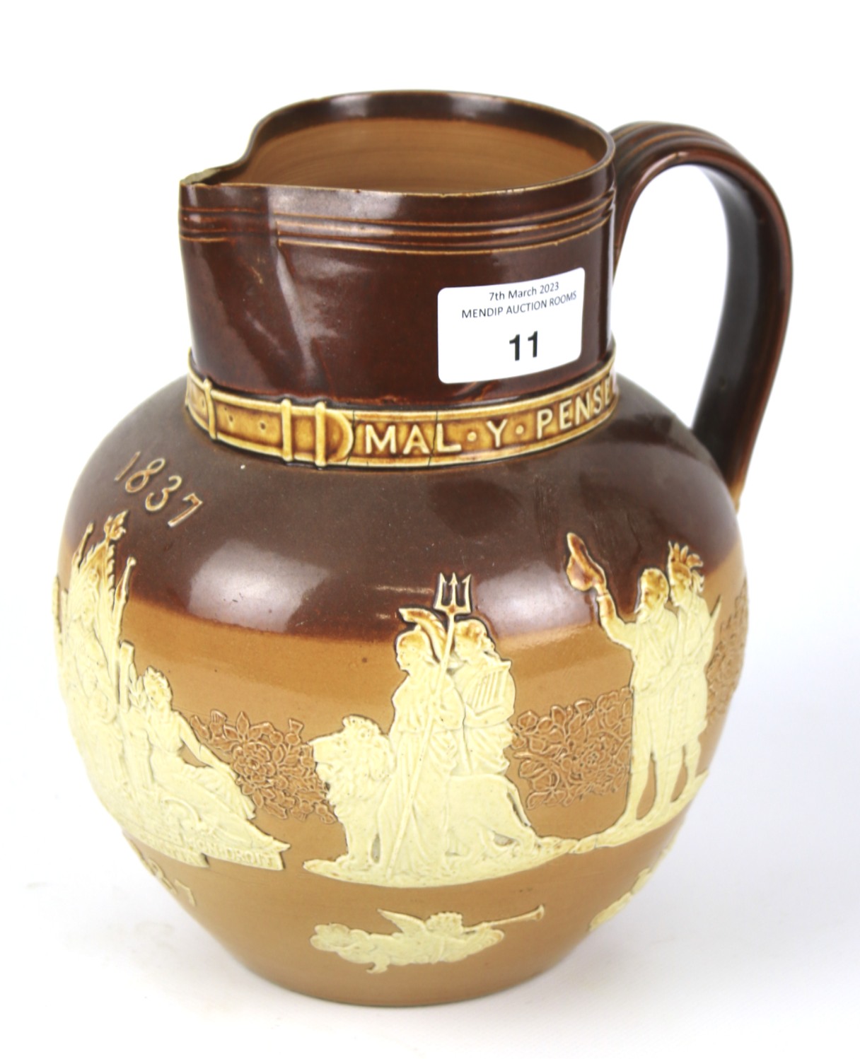 A Doulton stoneware jug commemorating Queen Victoria's Golden Jubilee.