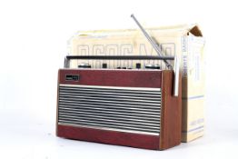 A vintage Roberts R606-MB portable radio. With maroon finish, in original box.