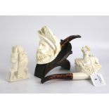 A group of Tobacciana collectables - two meerschaum pipes and a similar ornament.