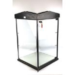 A shop counter glazed display cabinet. Key is present, no shelves.
