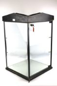 A shop counter glazed display cabinet. Key is present, no shelves.
