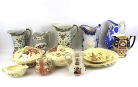 A Clarice Cliff 'Georgian Spray' part dinner service and assorted jugs.