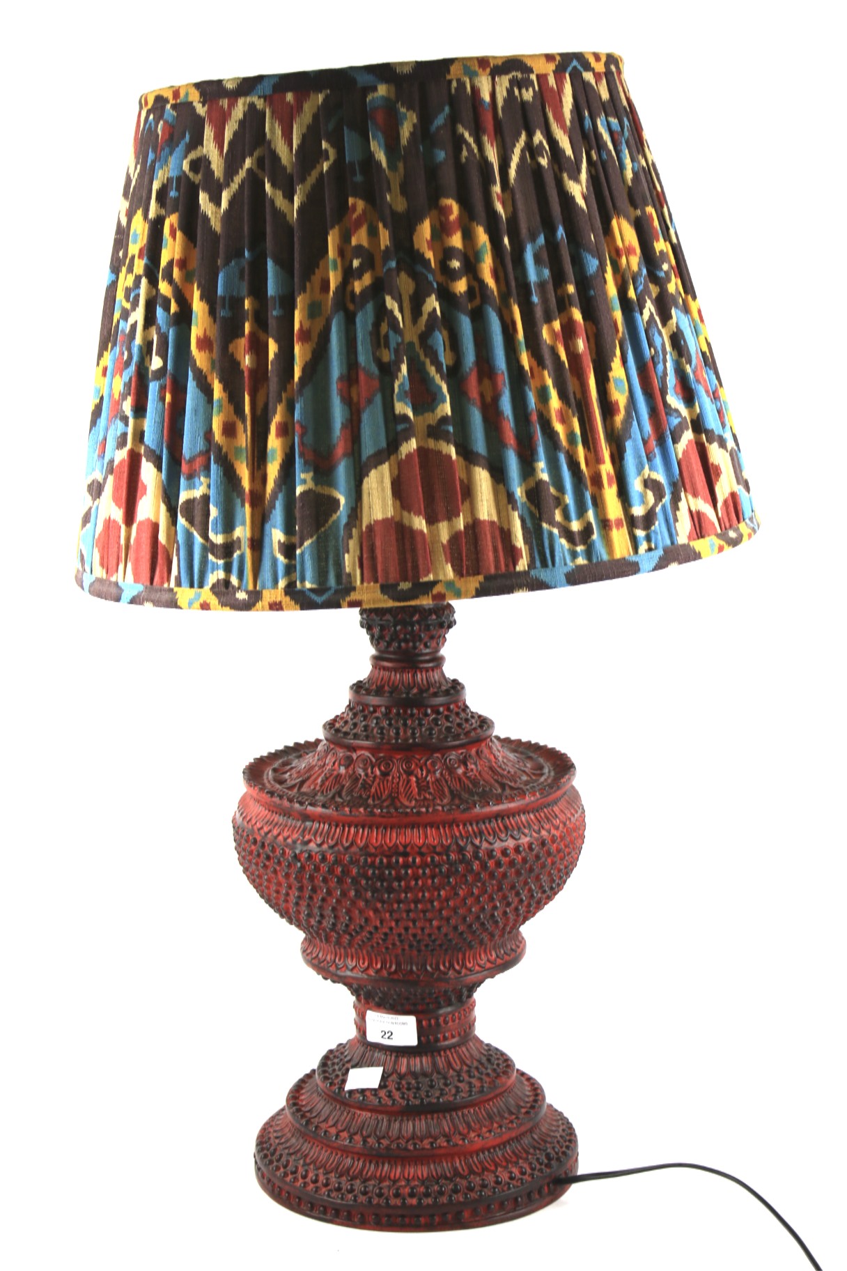 A large red cinnabar lacquered table lamp.