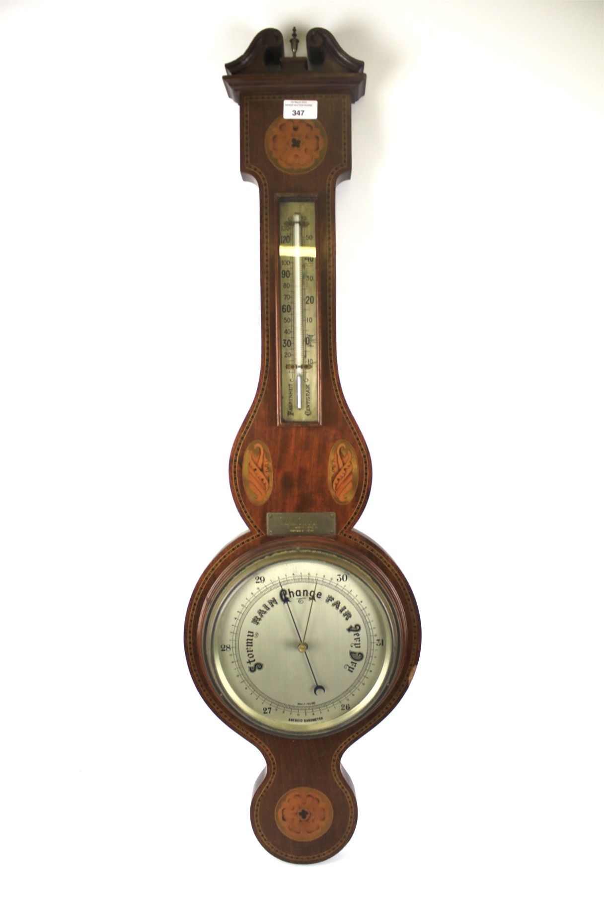 An early 20th century Georgian-style inlaid mahogany banjo barometer.