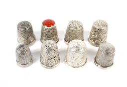 Eight vintage silver and white metal thimbles. With engraved and textured decoration, 26.