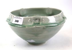 A blue glazed studio pottery bowl. With curved rim, impressed mark to the base, H10.