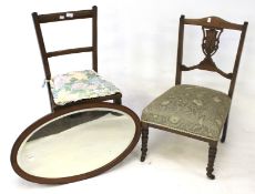 Two Edwardian chairs and a wall mirror.