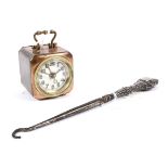 A vintage German D R P & G M travel alarm clock and a silver handled boot hook.