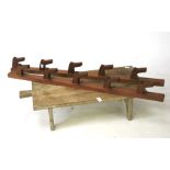 A small vintage bench top butchers block and two home made coat hooks.