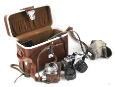 An assortment of cameras and lenses.