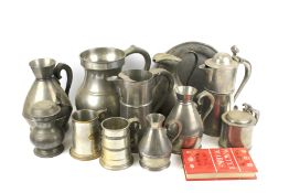 An assortment of vintage pewter. Including tankards, steins, a plate and jugs, etc. Max.