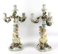 A pair of 19th century German Dresden style porcelain candelabra.