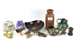 An assortment of ceramics. Including a Poole lidded pot, Beswick birds, a studio pottery jug, etc.