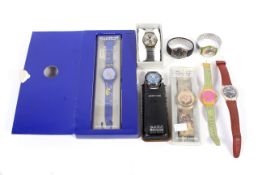 A collection of Swatch watches, some boxed.
