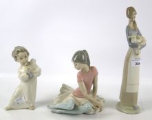 Three Lladro figures.