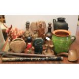 A collection of assorted Tribal items and soapstone sculptures.
