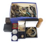 An assortment of costume jewellery. Including brooches, rings, beads, etc.