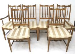 A set of six hardwood chairs.