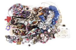 An assortment of costume jewellery. Including necklaces, broaches, bracelets, etc.