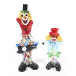 Two Murano glass clowns.