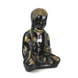 A cast plaster model of a Buddha.