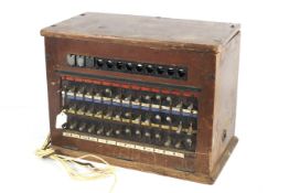A vintage GPO telephone switchboard CB935 in a mahogany box.