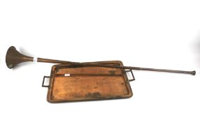 A coachman's brass and copper horn and a copper twin handled tray.