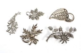 A collection of five ladies silver, white metal and marcasite Art Deco style brooches.