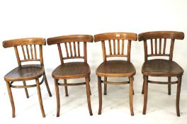 A set of four wooden chairs.