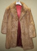 A woman's vintage French fur overcoat. Size 12.