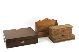 A vintage writing slope and two assorted wooden desk organisers.