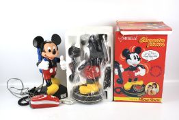 A boxed Mybelle Micky Mouse telephone and a tyco Micky Mouse telephone.