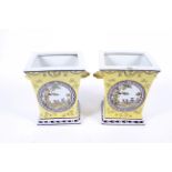 A pair of contemporary yellow ground glazed square twin handle vases.