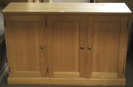 A contemporary oak cupboard.