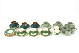 Three partial sets of coffee cups and saucers. Comprising Spode set in 'Flemish Green', a T.