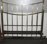 A 20th century double bed frame on ceramic casters.
