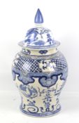 A large 20th century Chinese blue and white baluster jar and cover.