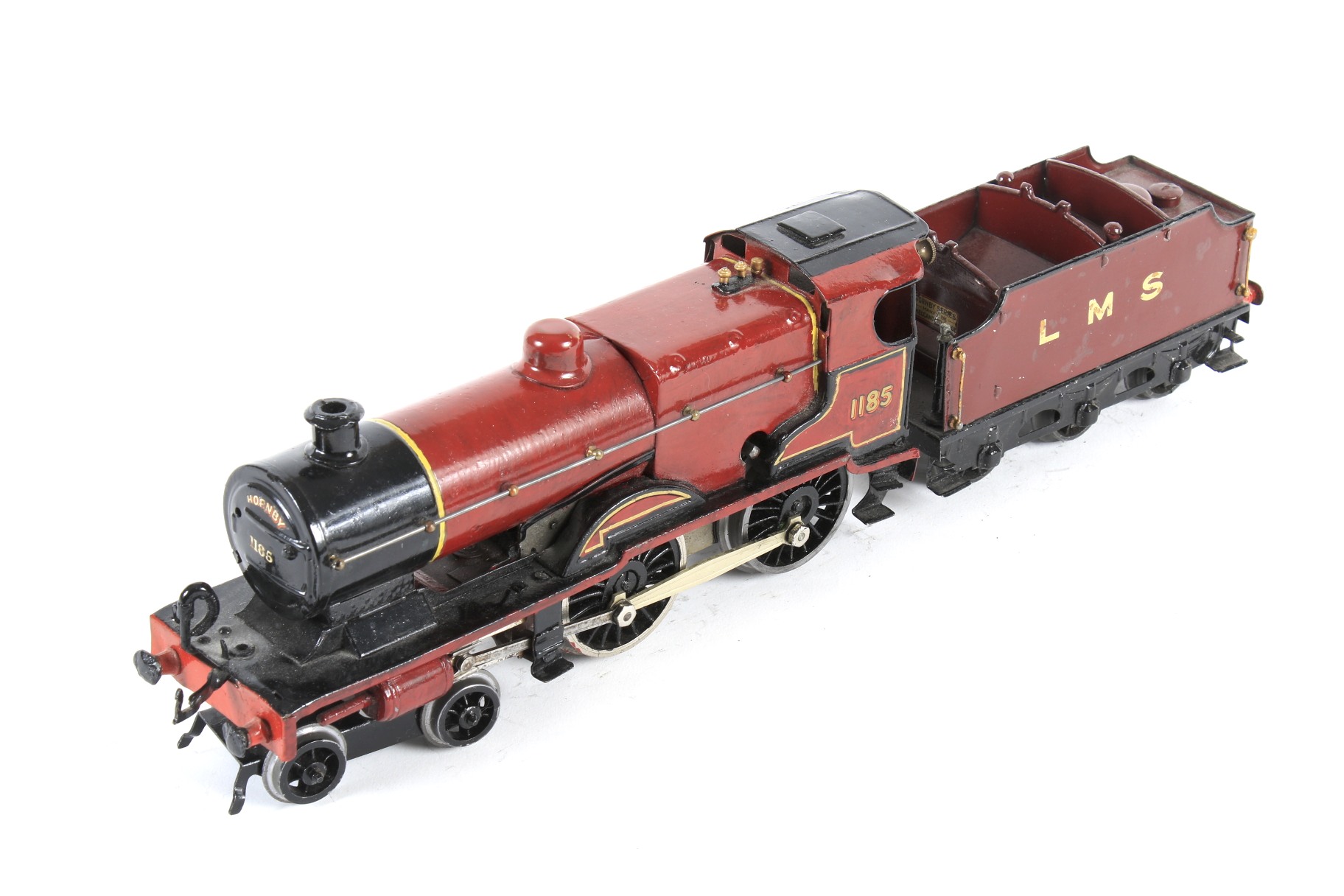 A Hornby O gauge clockwork tinplate locomotive and tender. 4-4-0, LMS livery, no.