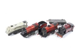 Four Hornby O gauge tinplate clockwork locomotives. Comprising a 0-4-0 'Silver Streak' no.