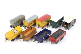 A collection of nine unboxed Hornby O gauge rolling stock wagons.