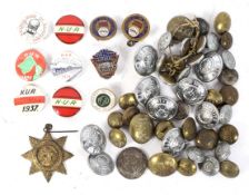 An assortment of railway buttons and badges.