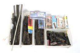 00 gauge collection of unboxed locomotives, building kits and track.