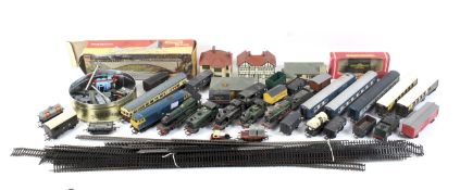 An assortment of OO gauge locomotives, carriages and rolling stock.