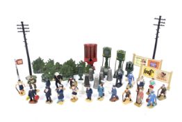 A collection of lead figures and train accessories.