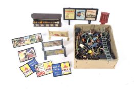 Collection of assorted railway accessories including lead figures, signs, etc.