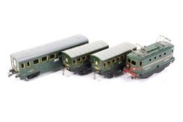 A French Hornby O gauge locomotive and three coaches. The locomotive in SNCF livery, no.